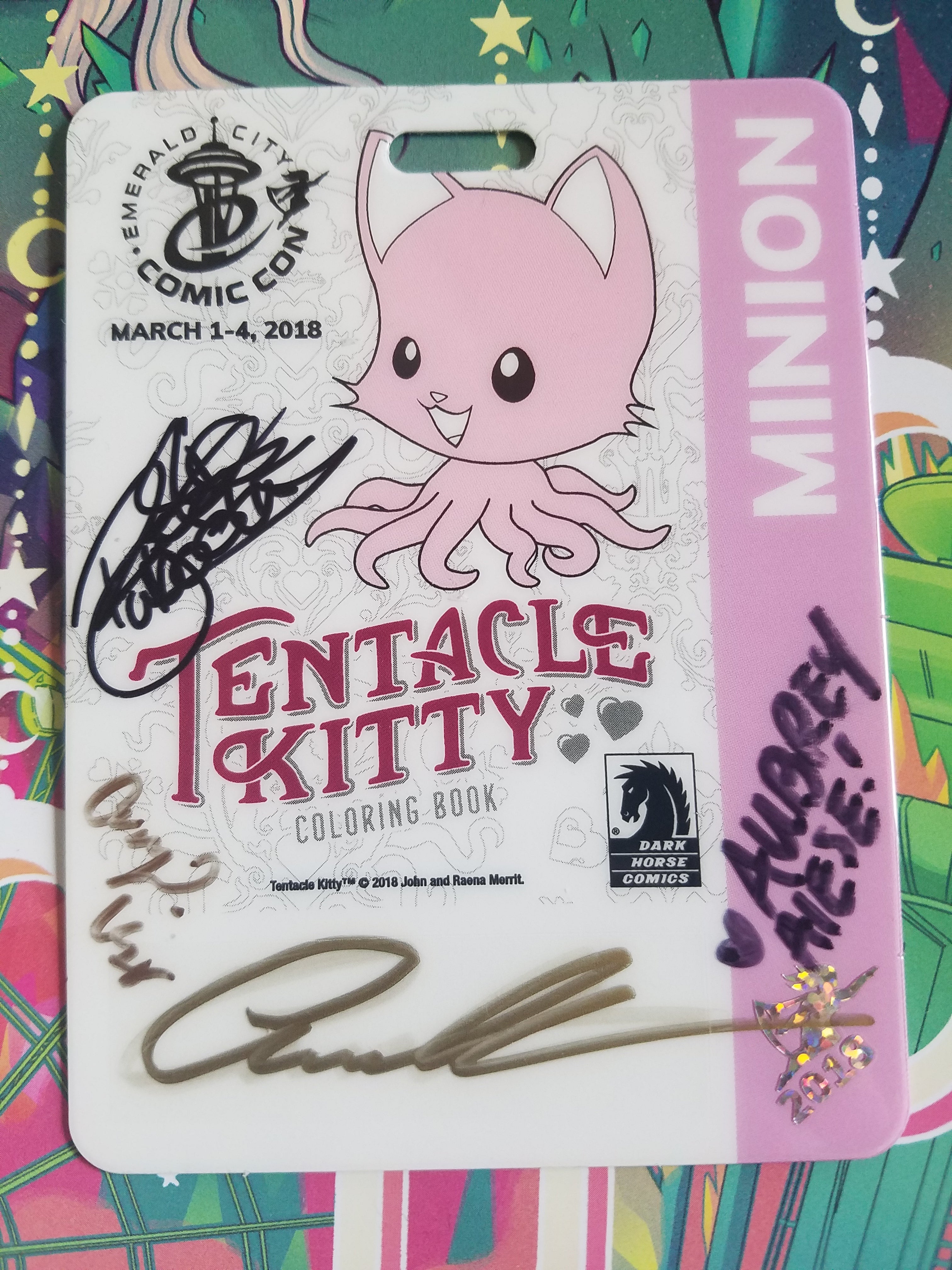 Tentacle Kitty was on an Emerald City Comic Con 2018 badge! Was signed by artists who worked on the Tentacle Kitty Dark Horse coloring book, John Merritt, Camilla D'errico, Aubrey Aiese, Amy King, Rootis Tabootis